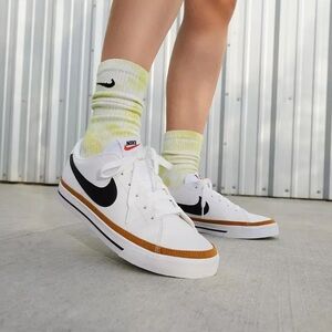 Nike White and Black Athletic Shoes with Orange Accents